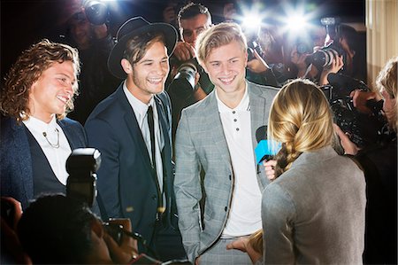 simsearch:6113-08088218,k - Celebrities being interviewed and photographed by paparazzi at event Stock Photo - Premium Royalty-Free, Code: 6113-08088185
