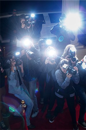 flash (camera flash) - Paparazzi photographers pointing cameras at red carpet event Stock Photo - Premium Royalty-Free, Code: 6113-08088198