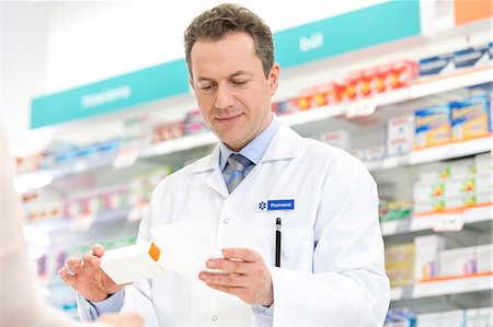 prescribe - Pharmacist filling prescription in pharmacy Stock Photo - Premium Royalty-Free, Code: 6113-08088396