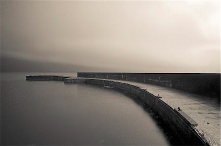 sepia toned - Pier along calm water, Streymoy, Faroe Islands Stock Photo - Premium Royalty-Free, Code: 6113-08088338