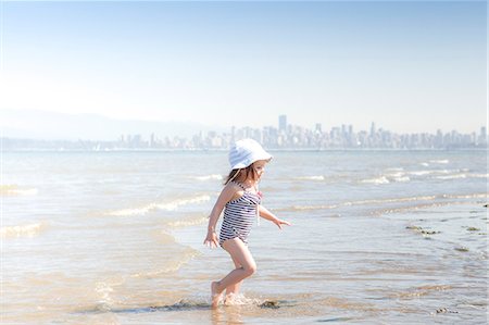 simsearch:614-07768068,k - Girl wading in surf on beach Stock Photo - Premium Royalty-Free, Code: 6113-08088521