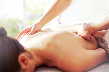 rubbing (massage) - Masseuse massaging woman's back Stock Photo - Premium Royalty-Free, Code: 6113-08105478