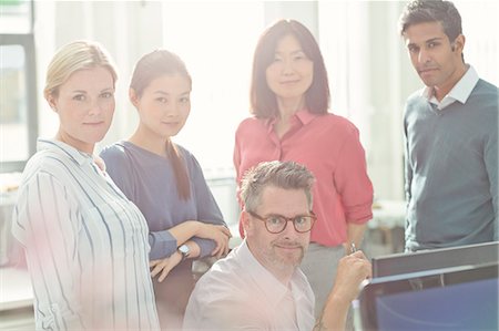 Portrait confident business people in sunny office Stock Photo - Premium Royalty-Free, Code: 6113-08220275
