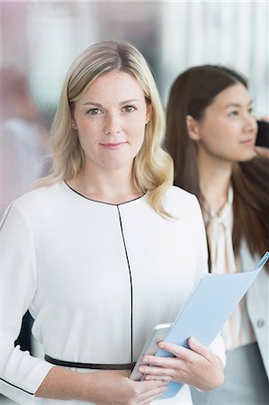 simsearch:6113-08743597,k - Portrait confident businesswoman with folder and digital tablet Stock Photo - Premium Royalty-Free, Code: 6113-08220371