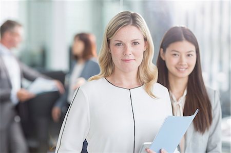 simsearch:6113-08743597,k - Portrait smiling businesswomen in office Stock Photo - Premium Royalty-Free, Code: 6113-08220315