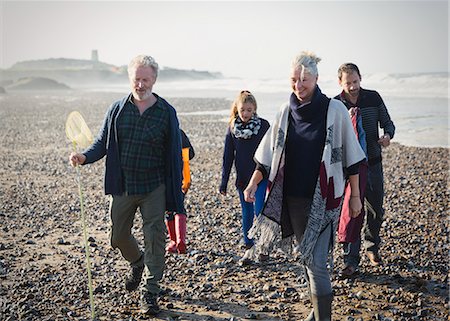 fishnet - Multi-generation family walking on sunny beach Stock Photo - Premium Royalty-Free, Code: 6113-08393717