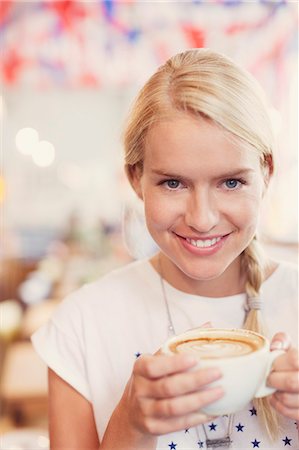 Close up portrait blonde woman drinking cappuccino Stock Photo - Premium Royalty-Free, Code: 6113-08321182