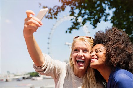 simsearch:6113-07648679,k - Friends taking selfie with London Eye in background, London, United Kingdom Stock Photo - Premium Royalty-Free, Code: 6113-08321106