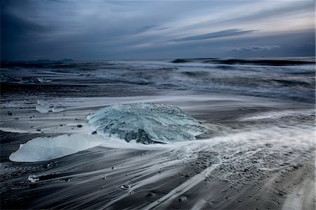 storms - Ice on stormy cold ocean beach, Jokulsarlon, Iceland Stock Photo - Premium Royalty-Free, Code: 6113-08321248