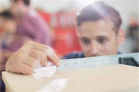 simsearch:400-07899762,k - Close up carpenter measuring wood with ruler Stock Photo - Premium Royalty-Free, Code: 6113-08321473