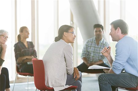 students - Business people discussing paperwork in meeting Stock Photo - Premium Royalty-Free, Code: 6113-08321512