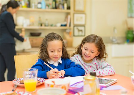 simsearch:400-05749563,k - Girls doing homework at breakfast table Stock Photo - Premium Royalty-Free, Code: 6113-08321628