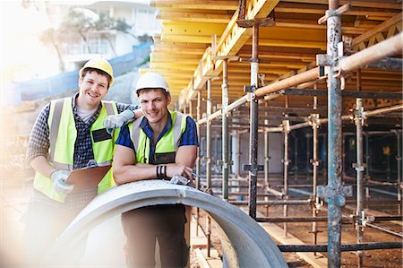 Portrait confident engineers with clipboard at construction site Stock Photo - Premium Royalty-Free, Code: 6113-08321742