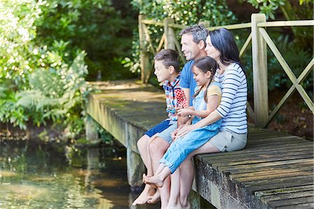 simsearch:649-07803505,k - Family sitting at the edge of dock Stock Photo - Premium Royalty-Free, Code: 6113-08424200