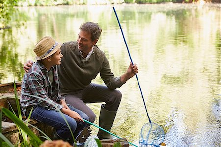 fishnet - Father and son fishing with nets in pond Stock Photo - Premium Royalty-Free, Code: 6113-08424237