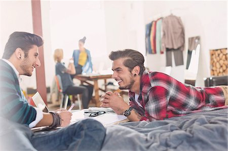 College students studying on bed in apartment Stock Photo - Premium Royalty-Free, Code: 6113-08568557