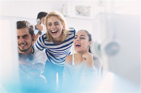 Creative business people laughing at computer in office Foto de stock - Sin royalties Premium, Código: 6113-08568563