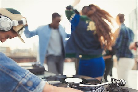 dj woman - DJ spinning records at rooftop party Stock Photo - Premium Royalty-Free, Code: 6113-08568515