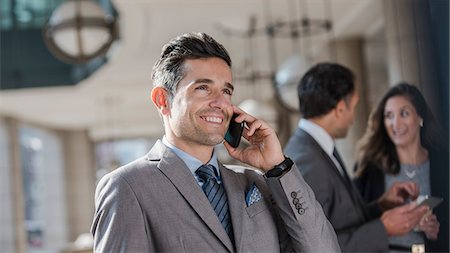 simsearch:649-07520071,k - Smiling corporate businessman talking on cell phone Stock Photo - Premium Royalty-Free, Code: 6113-08568670