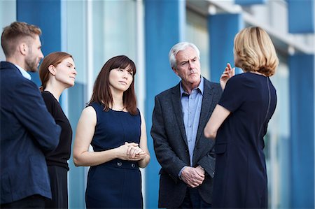simsearch:6113-07565839,k - Business people talking in lobby Stock Photo - Premium Royalty-Free, Code: 6113-08521399