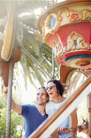 roundabout - Young couple taking selfie at amusement park Stock Photo - Premium Royalty-Free, Code: 6113-08521323