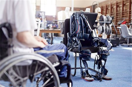 physiotherapy treatment - Man in wheelchair near physical therapy equipment Stock Photo - Premium Royalty-Free, Code: 6113-08521472