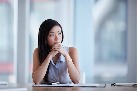 simsearch:649-07119200,k - Pensive businesswoman looking away in conference room Stock Photo - Premium Royalty-Free, Code: 6113-08521414