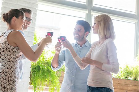 simsearch:6113-07543617,k - Friends toasting wine glasses Stock Photo - Premium Royalty-Free, Code: 6113-08521574