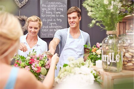 simsearch:400-04106195,k - Florist taking money from woman in flower shop Stock Photo - Premium Royalty-Free, Code: 6113-08536194