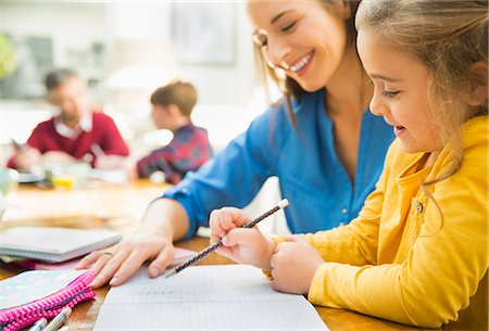 simsearch:6108-06166629,k - Mother helping daughter with homework Stock Photo - Premium Royalty-Free, Code: 6113-08655398