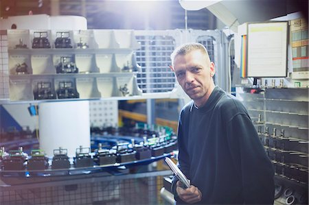 Portrait confident worker in steel factory Stock Photo - Premium Royalty-Free, Code: 6113-08655335