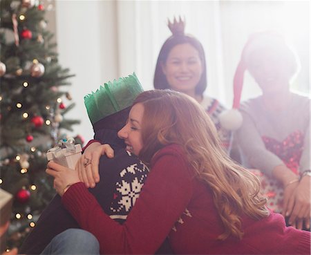 simsearch:700-06553388,k - Grateful girlfriend with Christmas gift hugging boyfriend Stock Photo - Premium Royalty-Free, Code: 6113-08659567