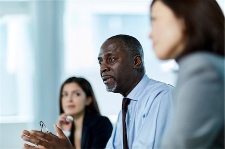 Serious businessman talking in meeting Stock Photo - Premium Royalty-Free, Code: 6113-08659658