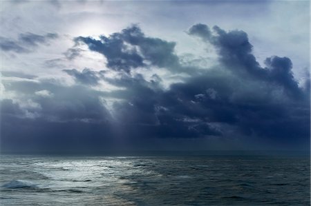 Clouds in sky over ocean, Devon, United Kingdom Stock Photo - Premium Royalty-Free, Code: 6113-08697984