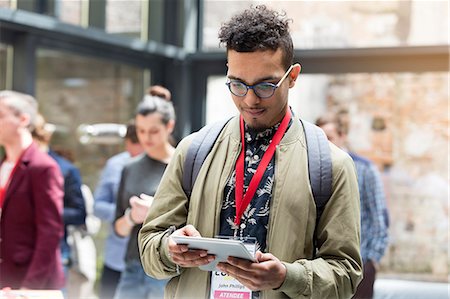 Man using digital tablet at technology conference Photographie de stock - Premium Libres de Droits, Code: 6113-08698043