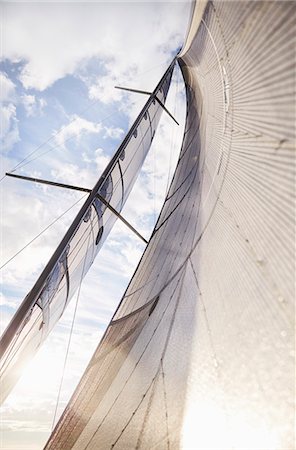 simsearch:614-00602699,k - Sailboat sail against sunny sky Stock Photo - Premium Royalty-Free, Code: 6113-08698142