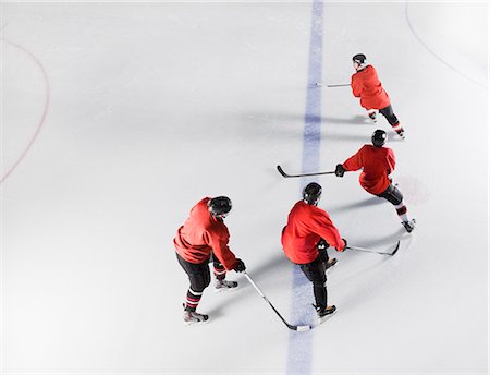 simsearch:6113-08698170,k - Hockey team in red uniforms skating on ice Stock Photo - Premium Royalty-Free, Code: 6113-08698154