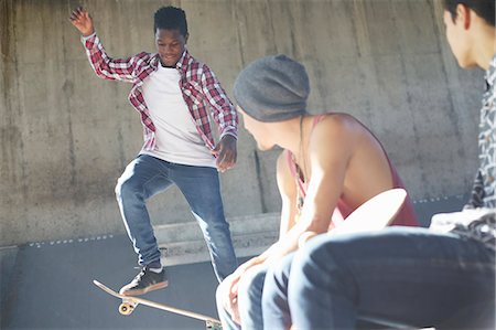 simsearch:649-07710443,k - Teenage boys skateboarding at skate park Stock Photo - Premium Royalty-Free, Code: 6113-08698192