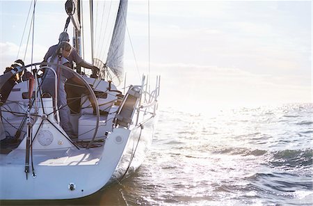simsearch:6122-07699789,k - Retired couple sailing on sunny ocean Stock Photo - Premium Royalty-Free, Code: 6113-08698121