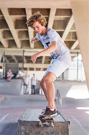 simsearch:649-07710443,k - Teenage boy skateboarding at skate park Stock Photo - Premium Royalty-Free, Code: 6113-08698250