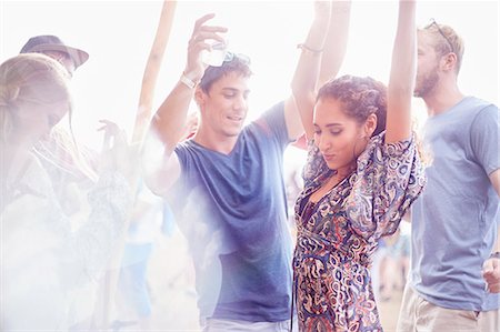 people food festival outdoors - Young couple dancing at music festival Stock Photo - Premium Royalty-Free, Code: 6113-08698287