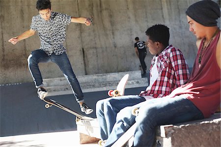 simsearch:649-07710443,k - Friends watching teenage boy doing stunt at skate park Stock Photo - Premium Royalty-Free, Code: 6113-08698206