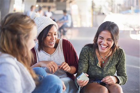 funny images of indian people - Teenage girls with cell phone laughing and hanging out Stock Photo - Premium Royalty-Free, Code: 6113-08698209