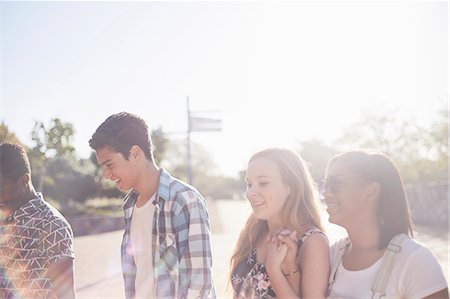 simsearch:695-03382482,k - Teenage friends hanging out at sunny park Stock Photo - Premium Royalty-Free, Code: 6113-08698221