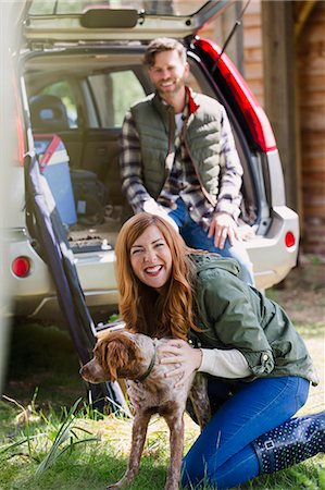 simsearch:6113-07242393,k - Portrait enthusiastic woman with dog outside car Stock Photo - Premium Royalty-Free, Code: 6113-08743478