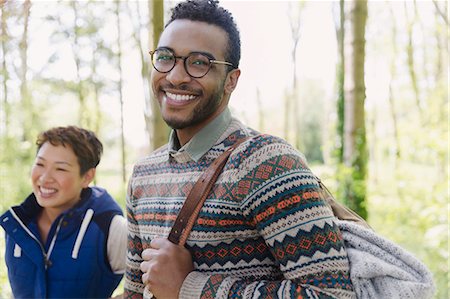 simsearch:6113-08743597,k - Portrait smiling man with backpack hiking in woods Stock Photo - Premium Royalty-Free, Code: 6113-08743479