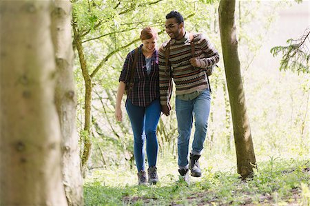 freedom backpacking - Couple holding hands hiking in woods Stock Photo - Premium Royalty-Free, Code: 6113-08743485