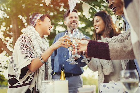 simsearch:6113-08659553,k - Friends toasting champagne glasses at birthday party Stock Photo - Premium Royalty-Free, Code: 6113-08743581