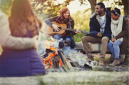 simsearch:6113-07147024,k - Friends playing guitar and drinking beer at campfire Stock Photo - Premium Royalty-Free, Code: 6113-08743593