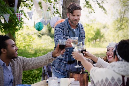 simsearch:6113-08659553,k - Friends toasting wine glasses at garden party table Stock Photo - Premium Royalty-Free, Code: 6113-08743535
